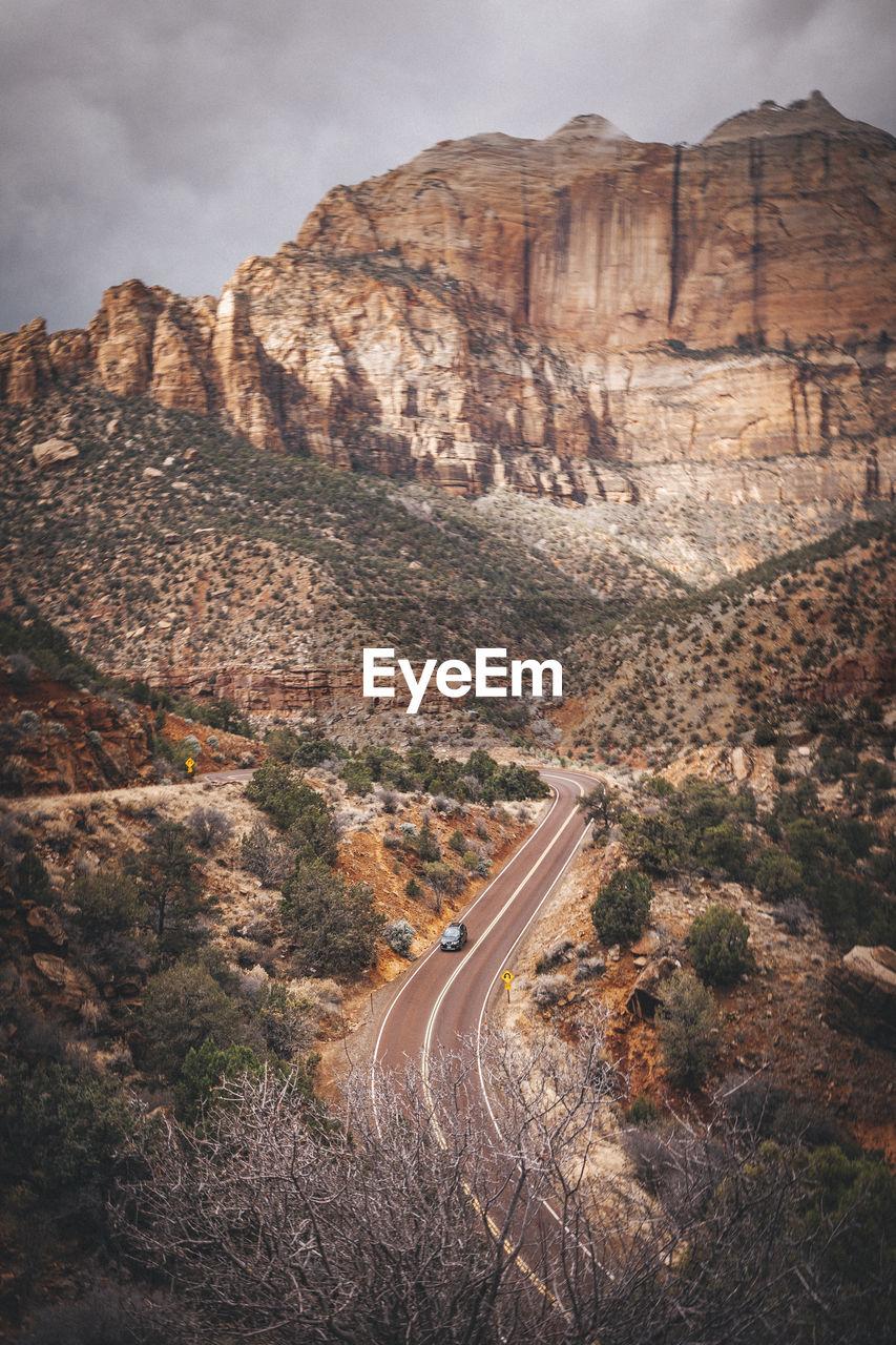 A road between mountains in zion national park, utah