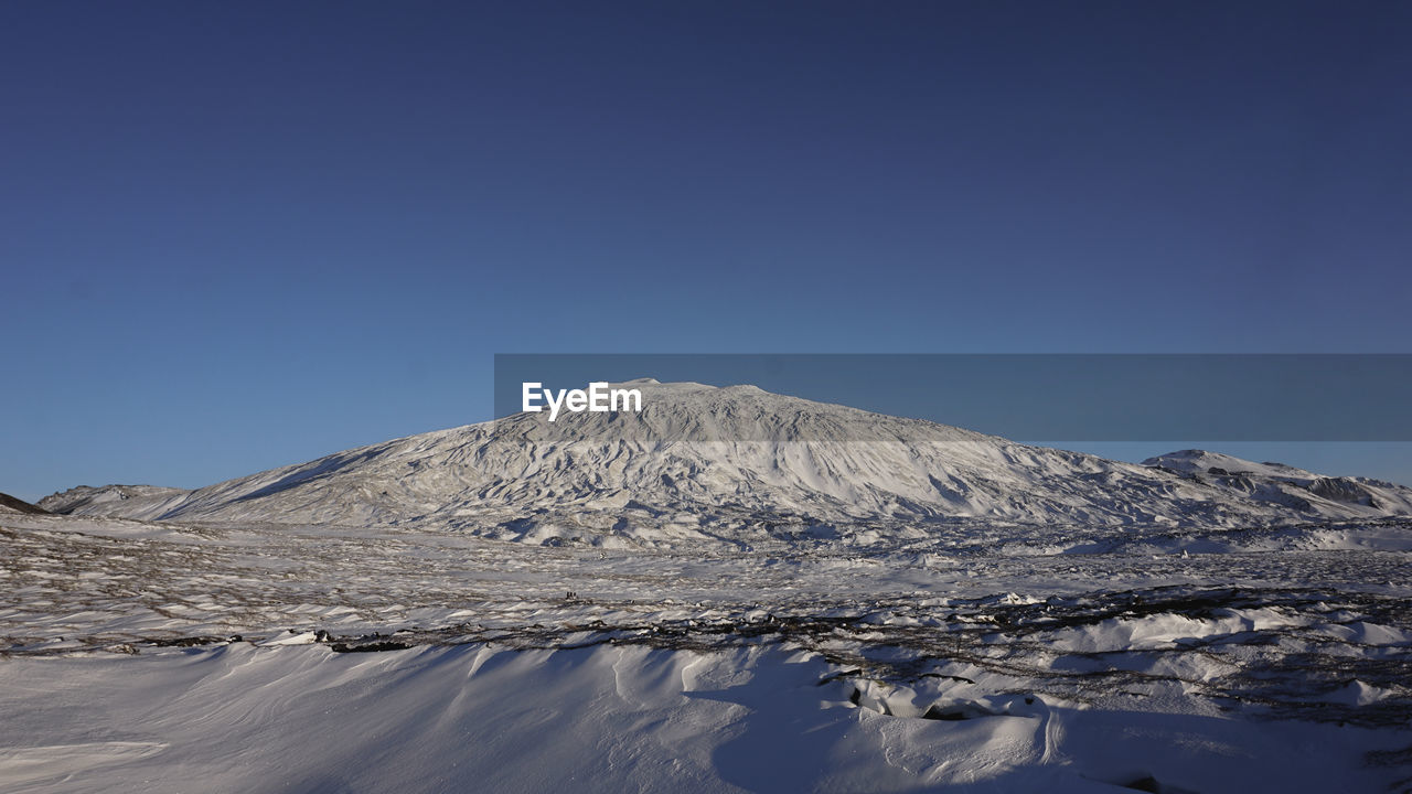 SNOWCAPPED MOUNTAIN AGAINST CLEAR BLUE SKY