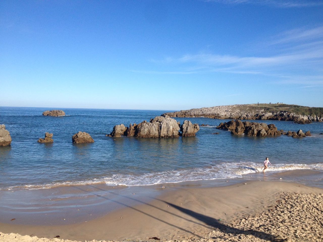 Scenic view of sea against clear blue sky