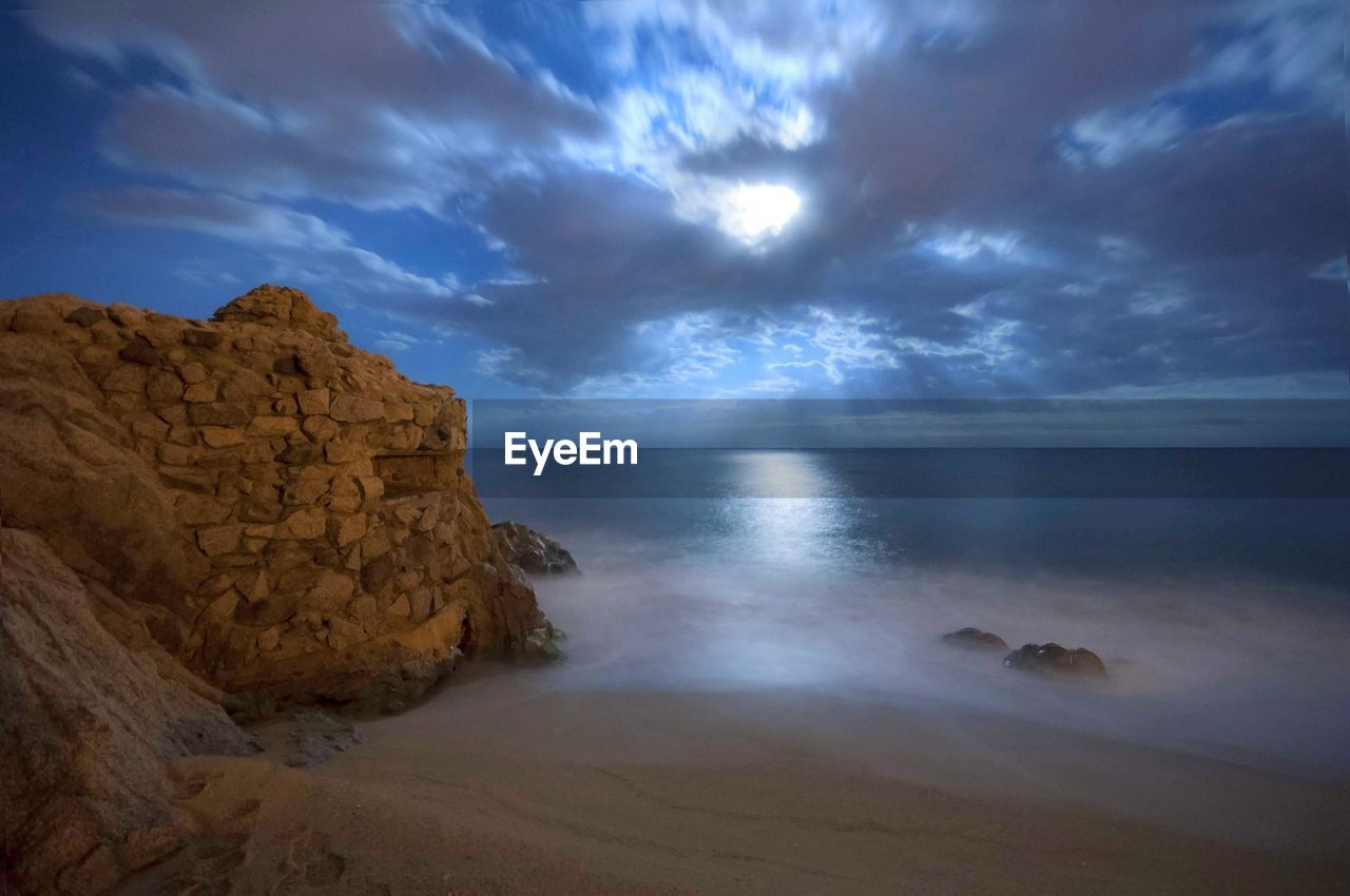 Idyllic shot of sea against sky at night