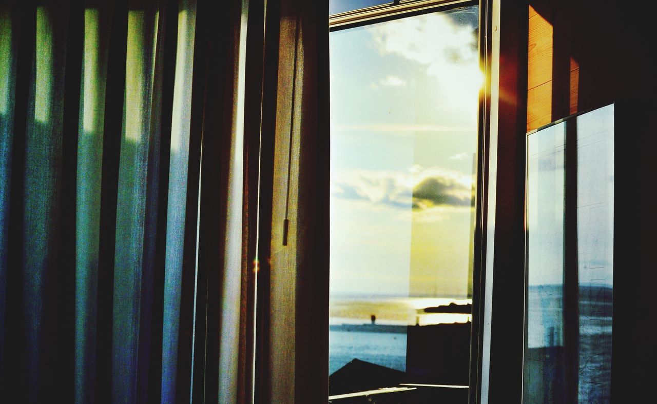 Calm blue sea through window