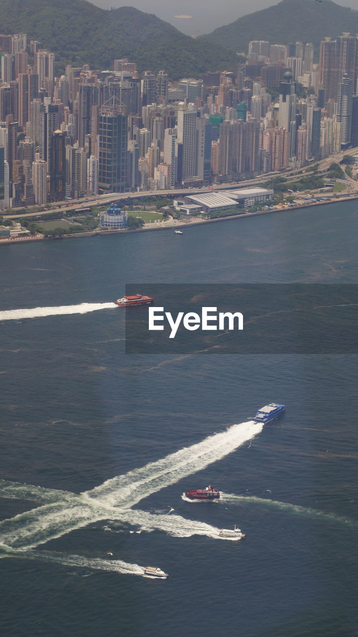 HIGH ANGLE VIEW OF BUILDINGS BY SEA