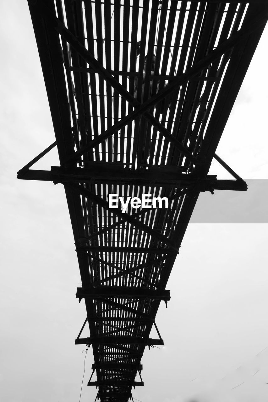 Low angle view of footbridge against clear sky