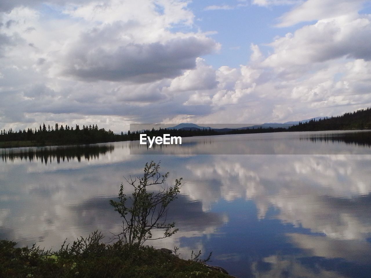 REFLECTION OF SKY ON LAKE
