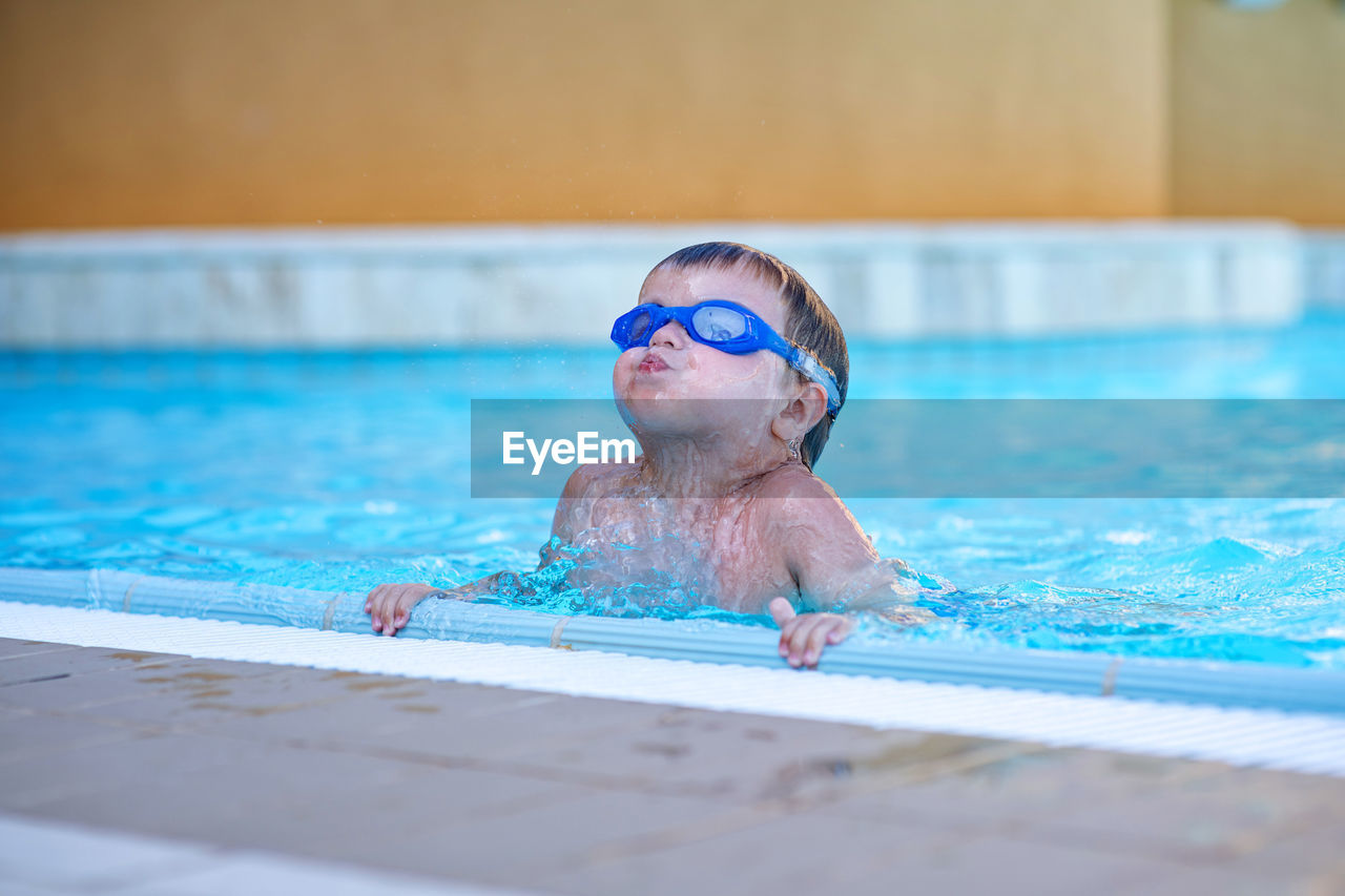 Close-up of boy in swimming pool
