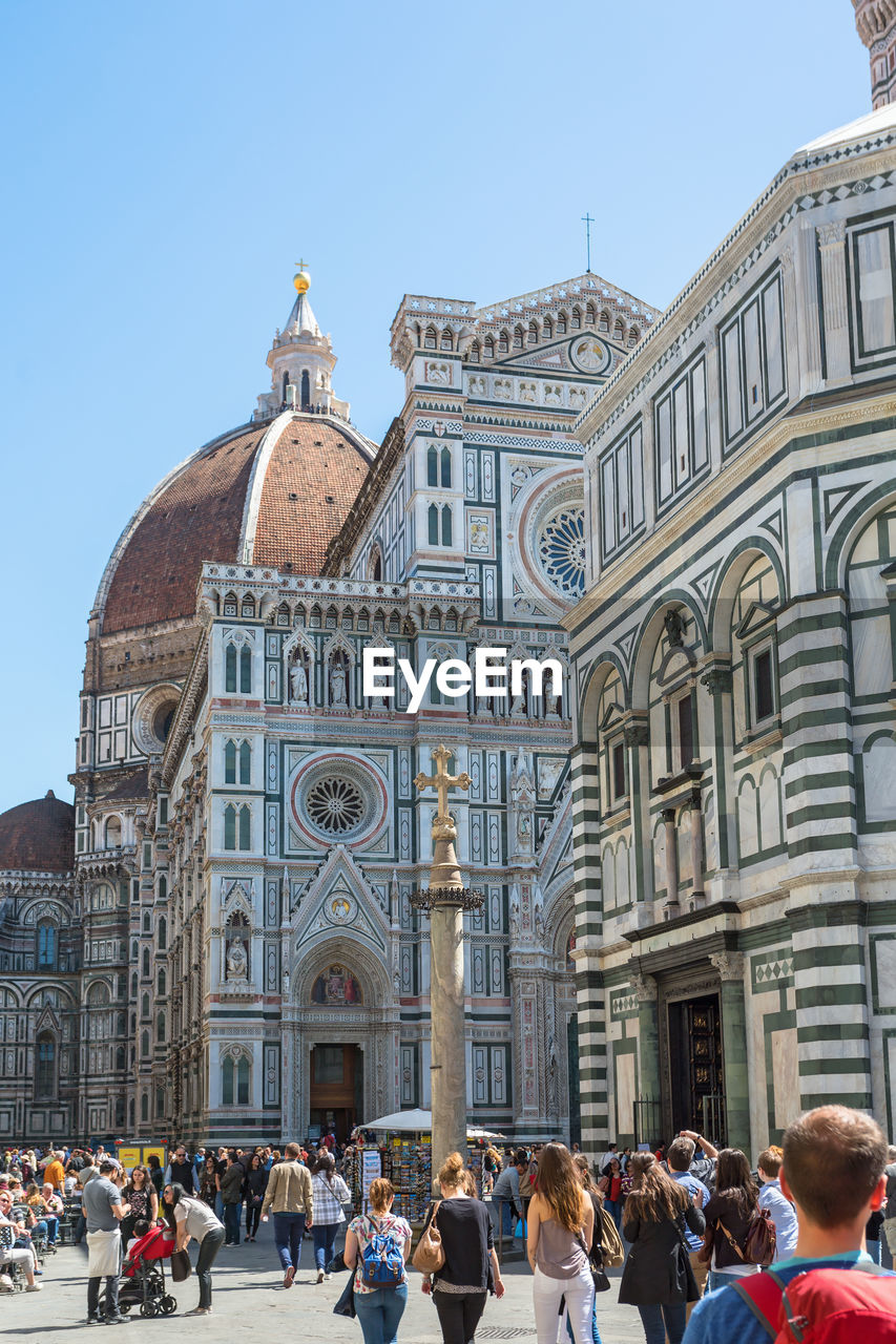 People walking on the piazza del duomo at cattedrale di santa maria del fiore in florence