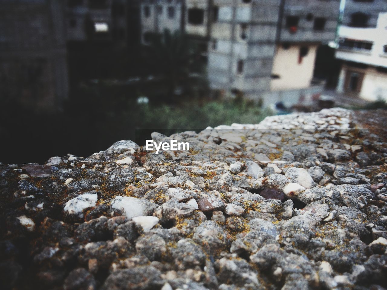 CLOSE-UP OF ROCKS AGAINST WATER