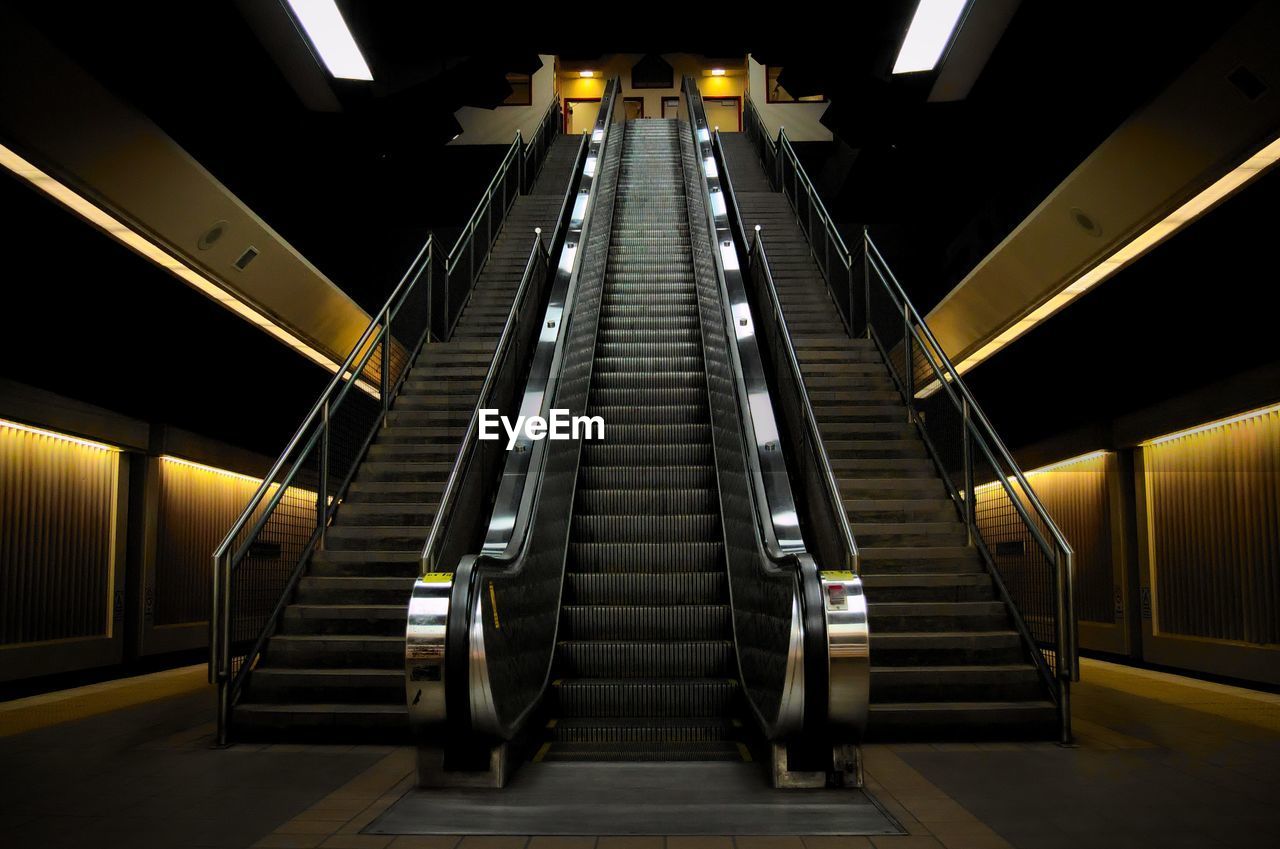 LOW ANGLE VIEW OF ILLUMINATED UNDERGROUND SUBWAY STATION