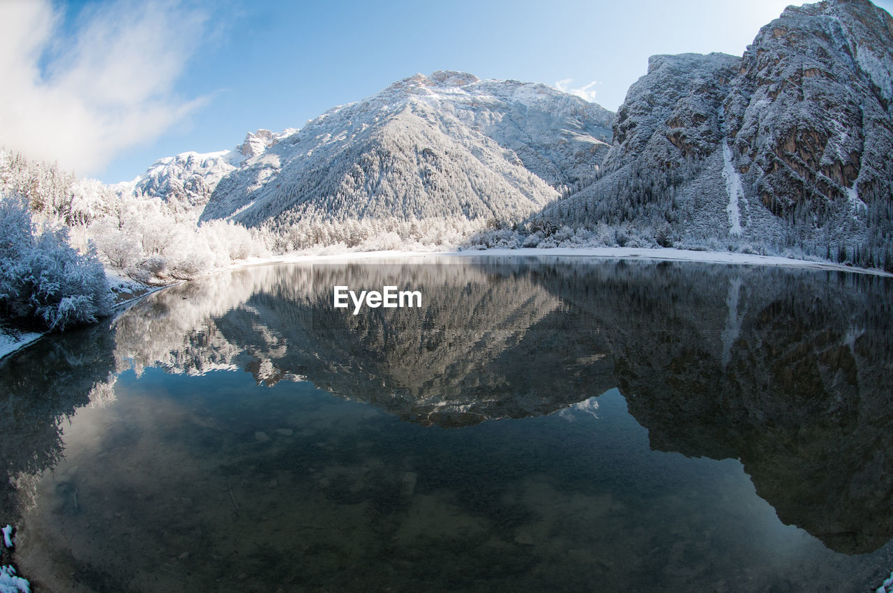 Reflection of mountains in calm lake