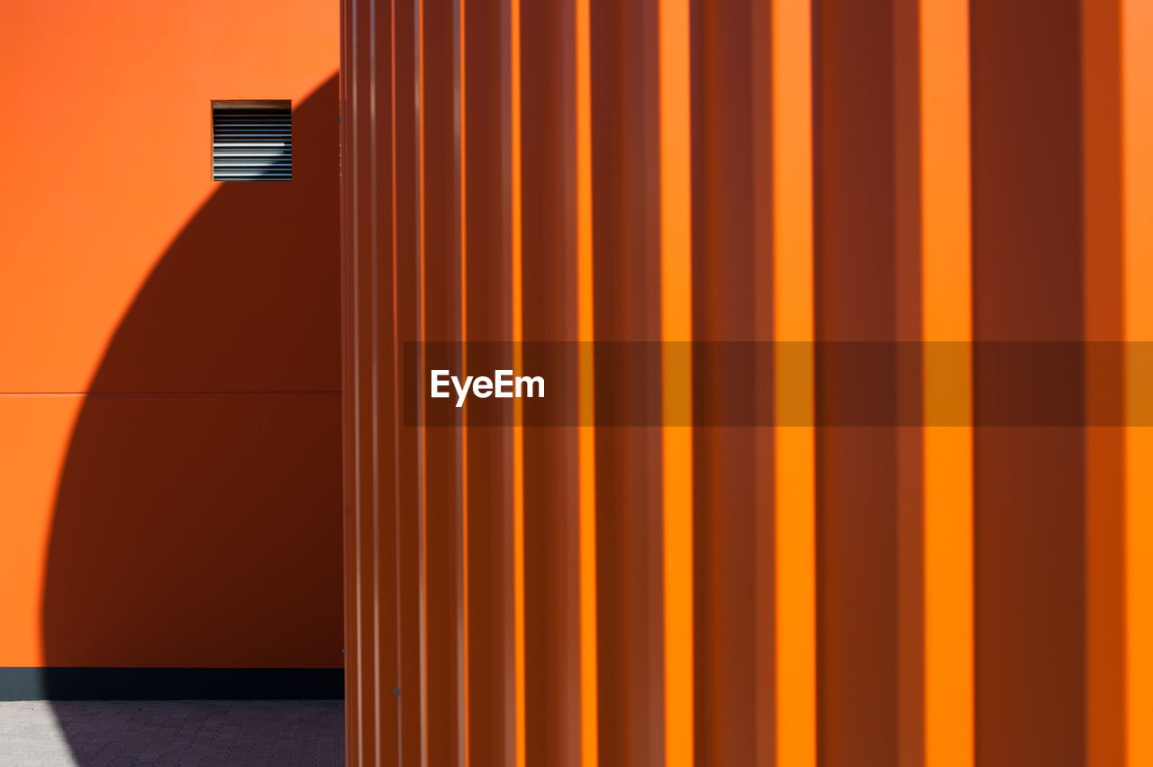 Close-up of orange wall in building