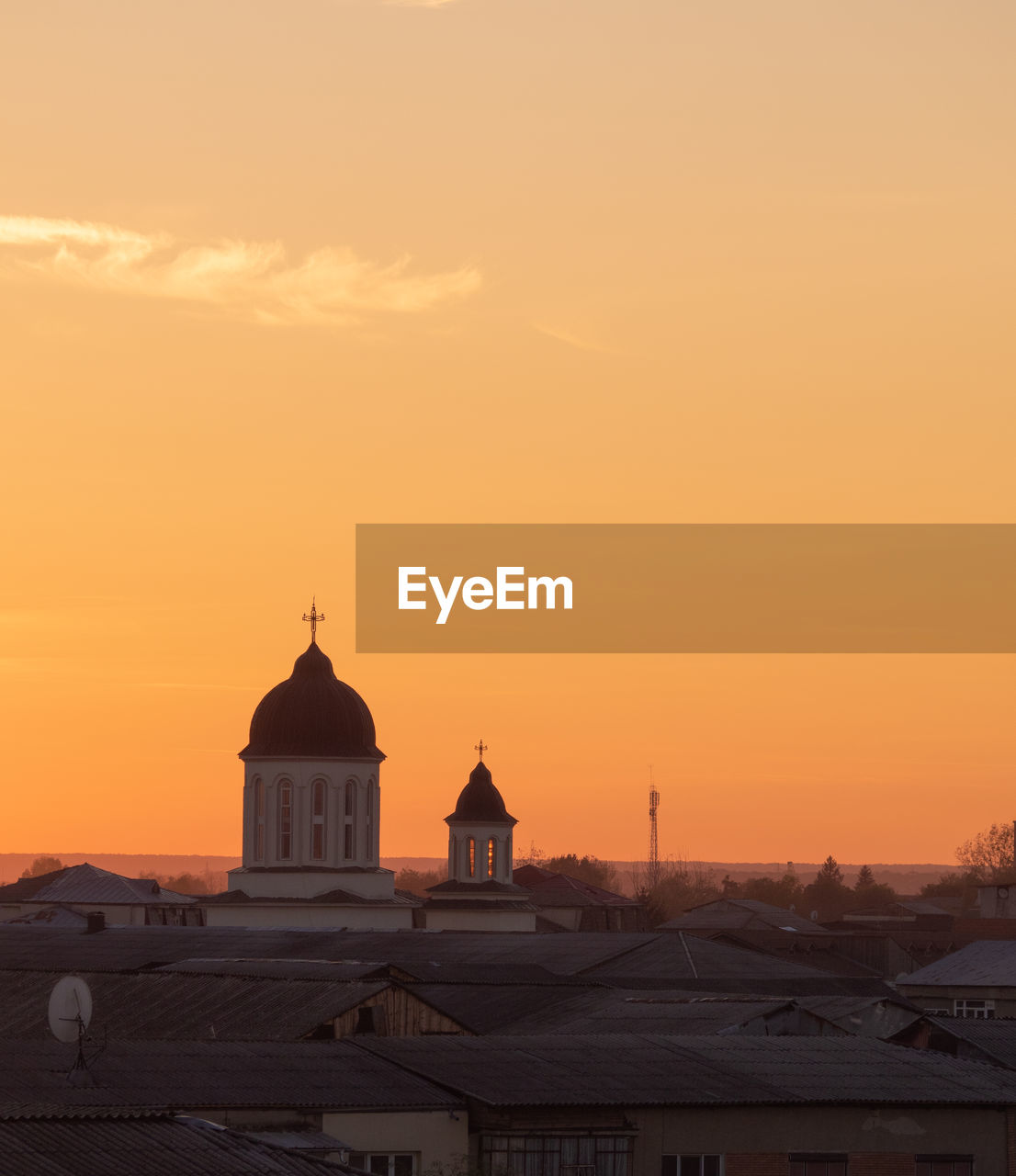 CATHEDRAL AGAINST ORANGE SKY