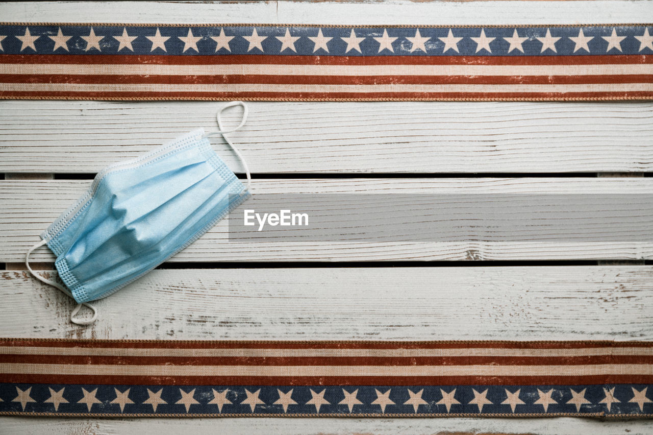 American stars and stripes flat lay over rustic wood background