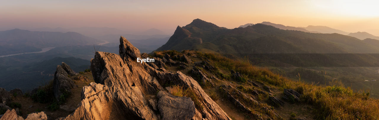 Panoramic view of mountain range against sky during sunset