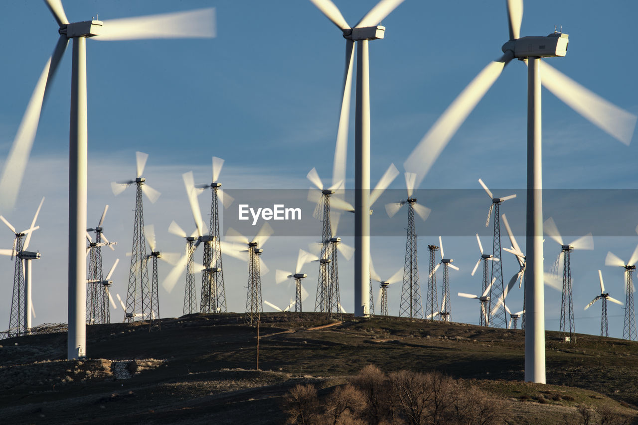 Windmills dot the california mountainside near mojave desert