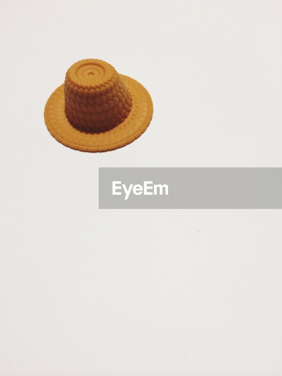 High angle view of toy sun hat against white background