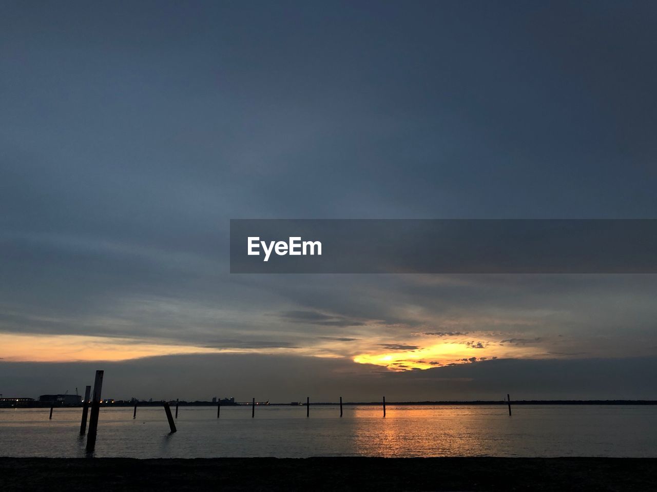 SCENIC VIEW OF SEA AGAINST ORANGE SKY