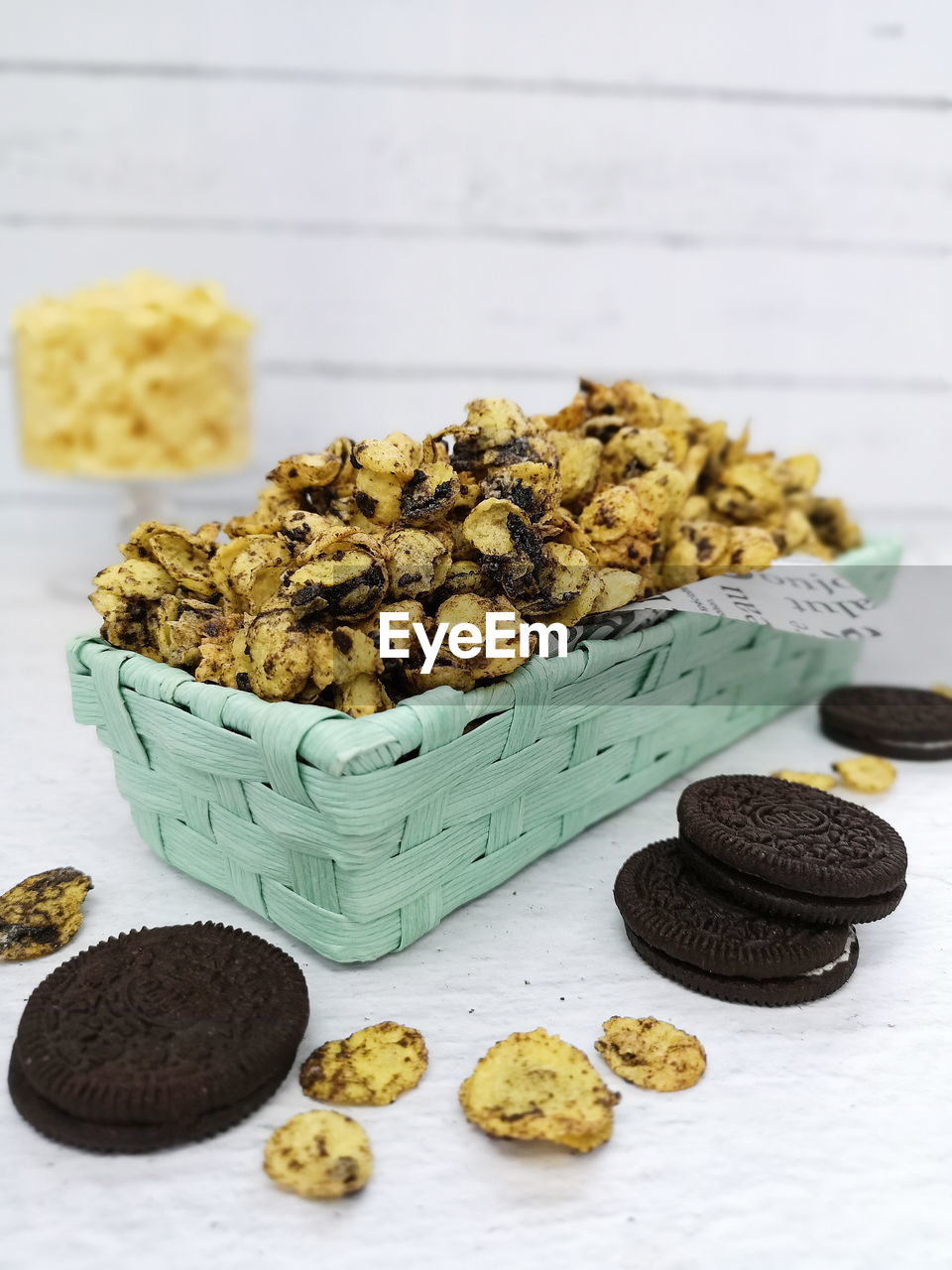 CLOSE-UP OF COOKIES ON TABLE AGAINST WALL