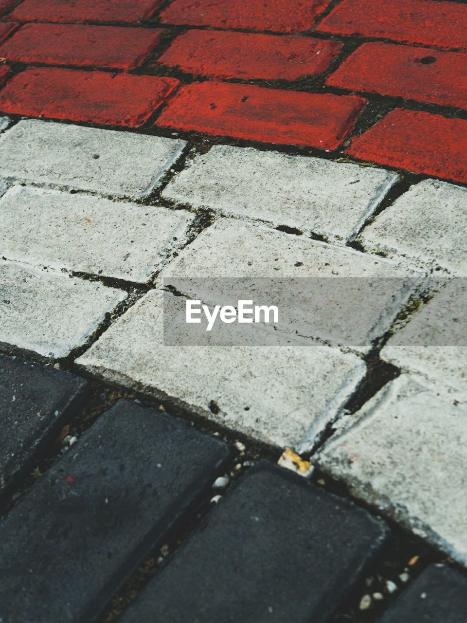 HIGH ANGLE VIEW OF COBBLESTONE