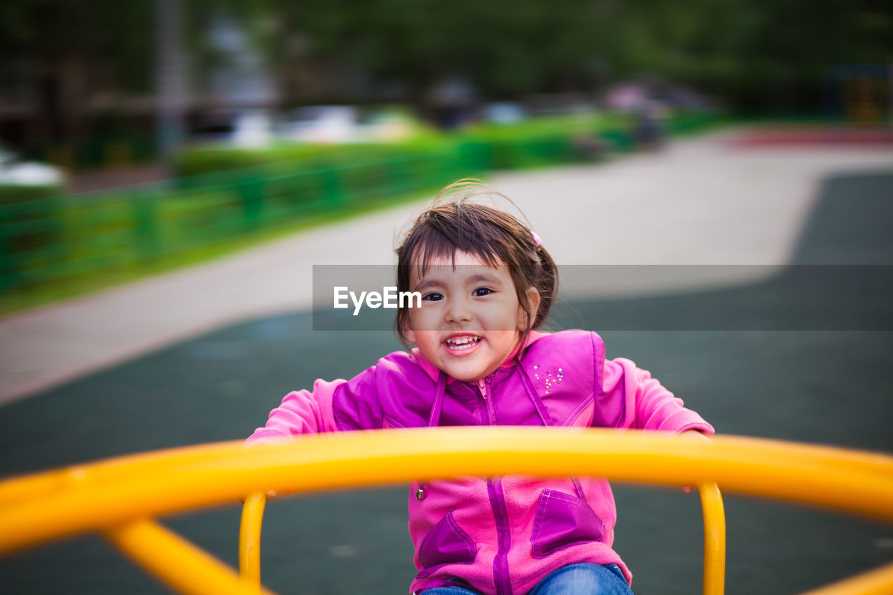 Portrait of smiling girl in playground