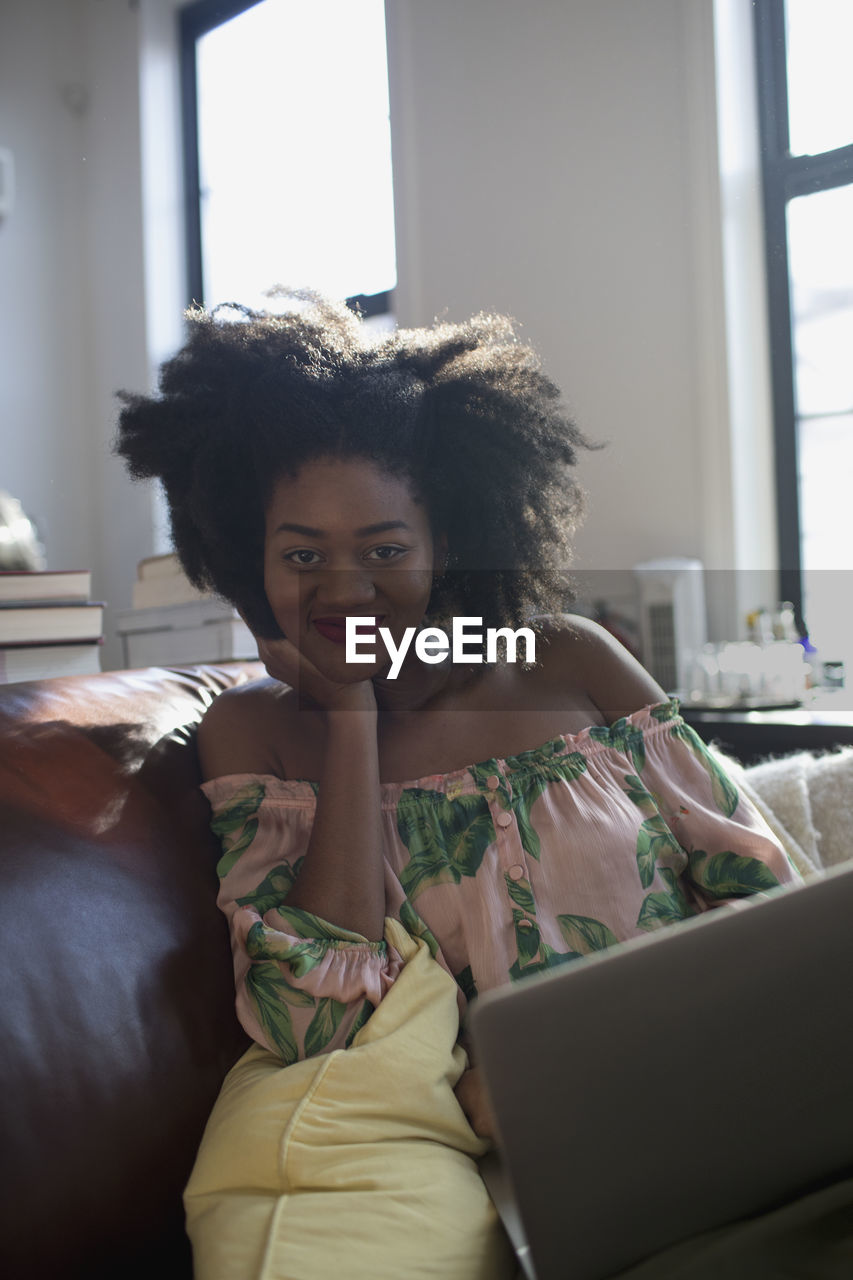 A young woman with a laptop