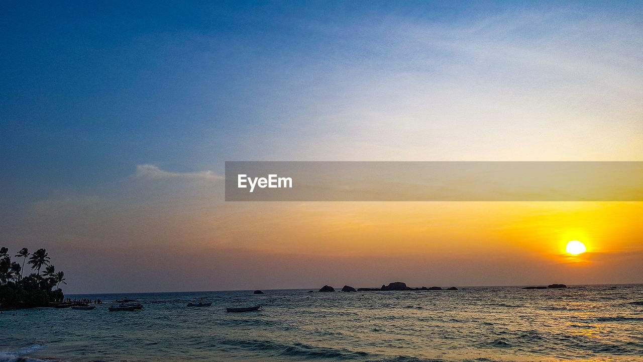 SCENIC VIEW OF SEA DURING SUNSET