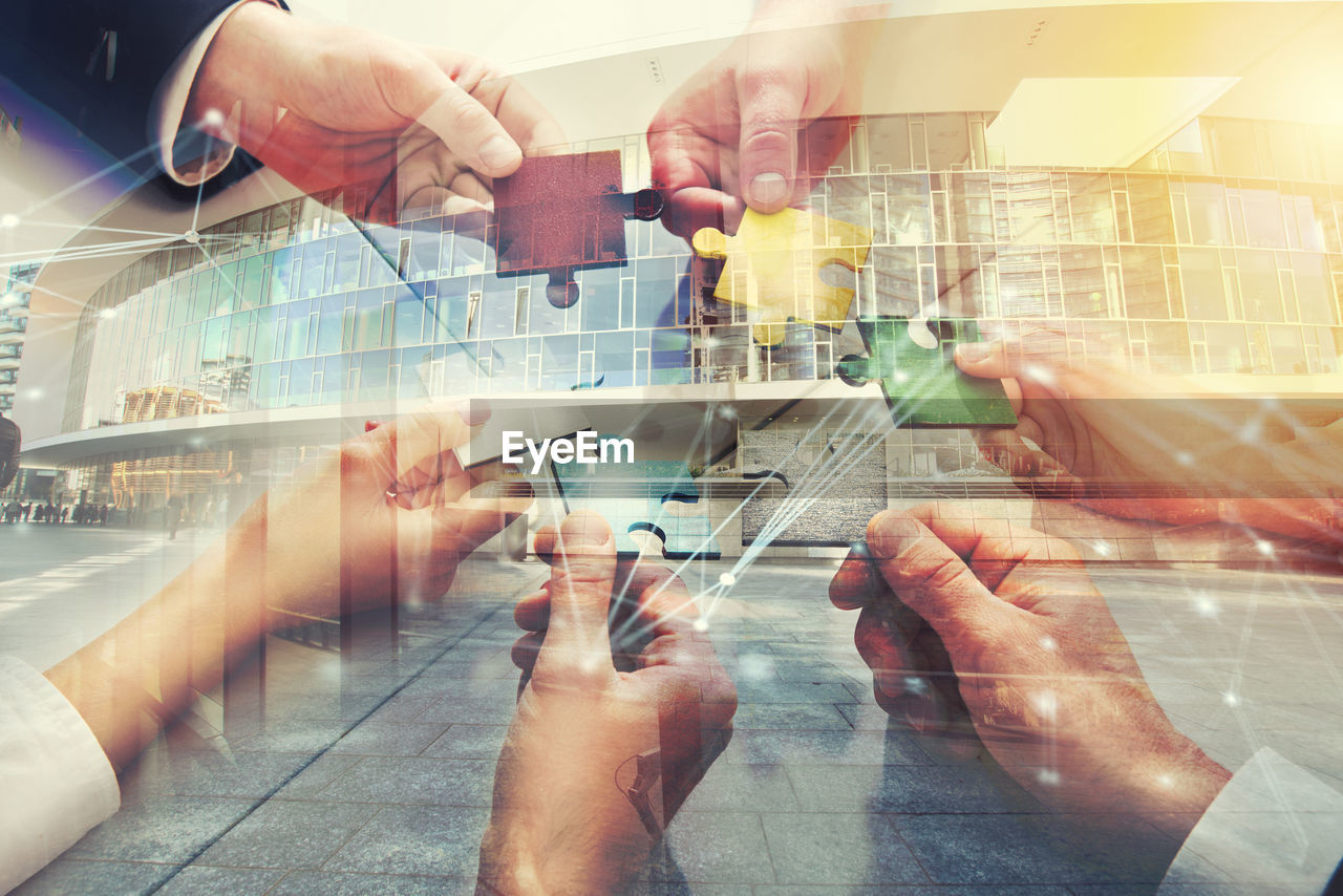 hand, adult, business, communication, men, technology, wireless technology, group of people, architecture, digital composite, city, indoors, business finance and industry, multiple exposure, futuristic, art, internet, computer network, women