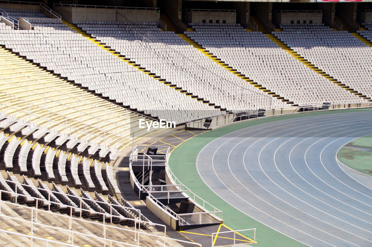 High angle view of empty soccer and athletics stadium, barcelona 