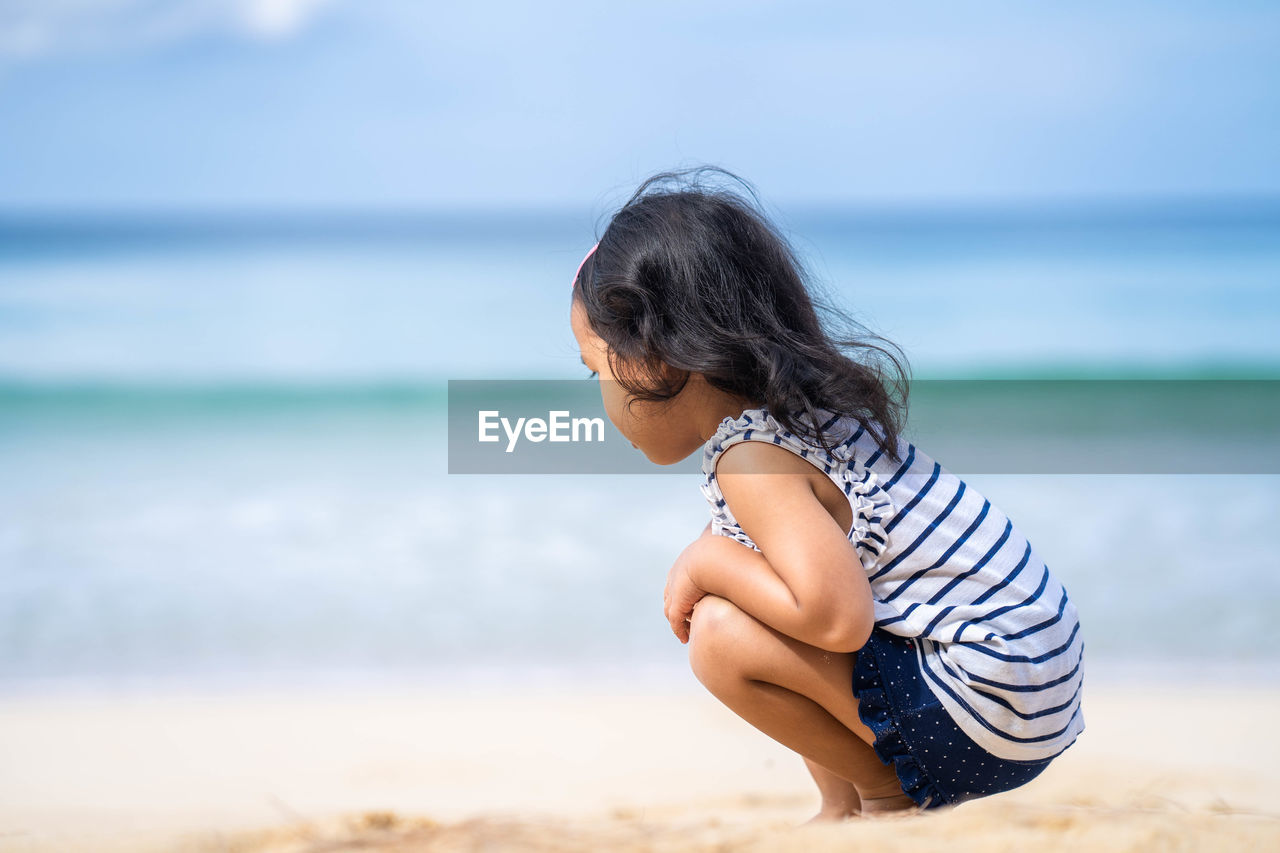 Side view of woman on beach