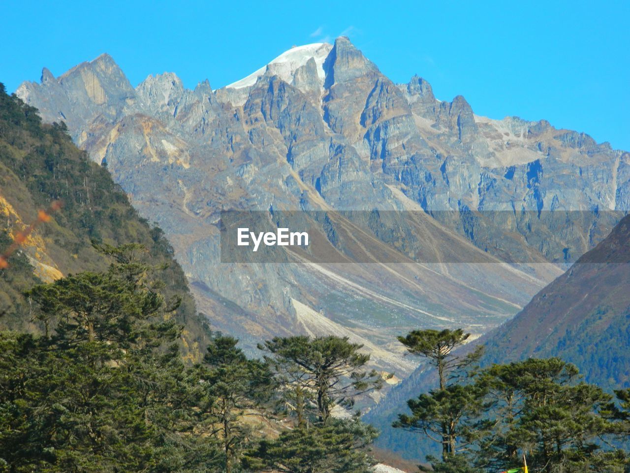 VIEW OF MOUNTAIN RANGE AGAINST BLUE SKY