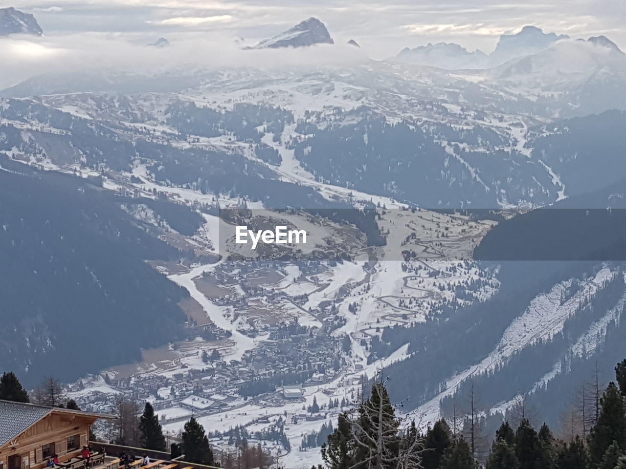 AERIAL VIEW OF SNOWCAPPED MOUNTAINS AND CITY