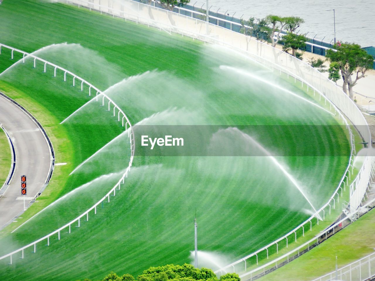 High angle view of racecourse with sprinklers
