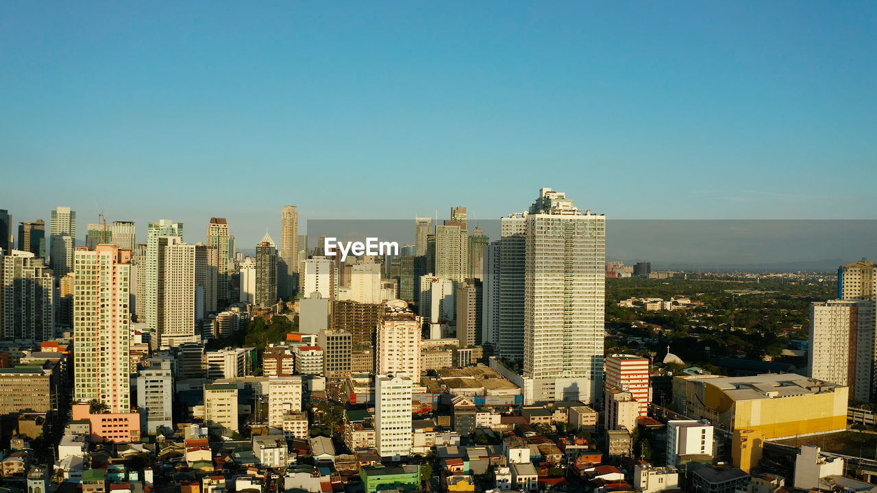 Skyscrapers and business centers in a big city manila. modern metropolis in asia, top view.