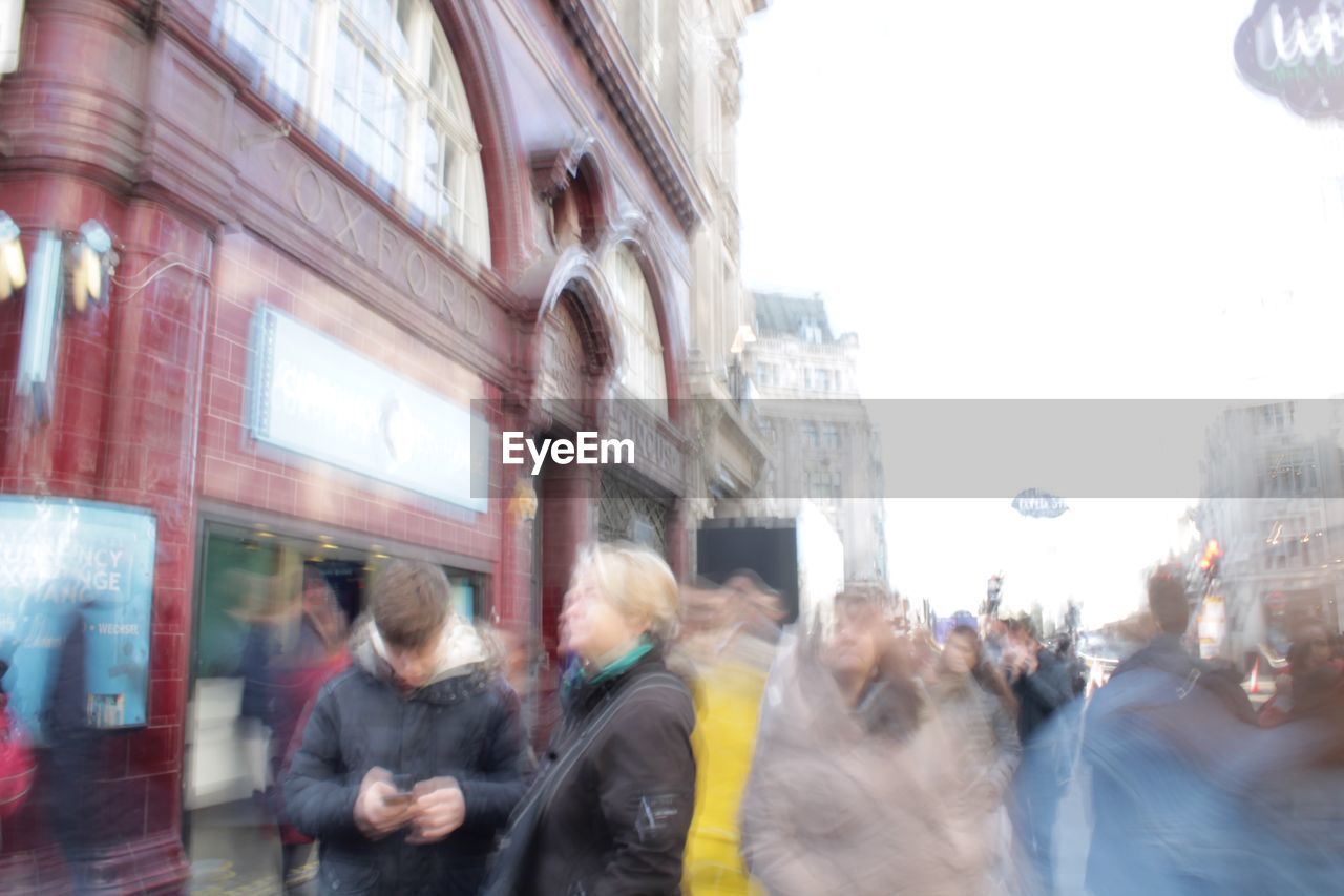 PEOPLE ON STREET IN CITY