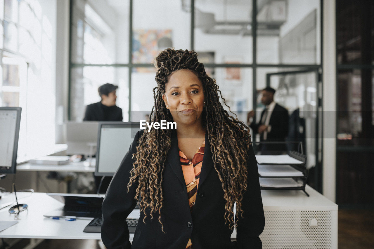Portrait of mature businesswoman with dreadlocks at office