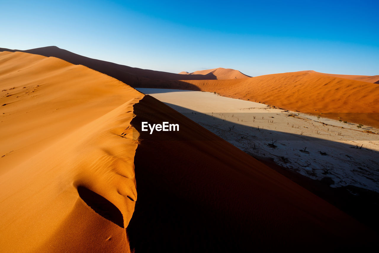 Scenic view of desert against clear sky