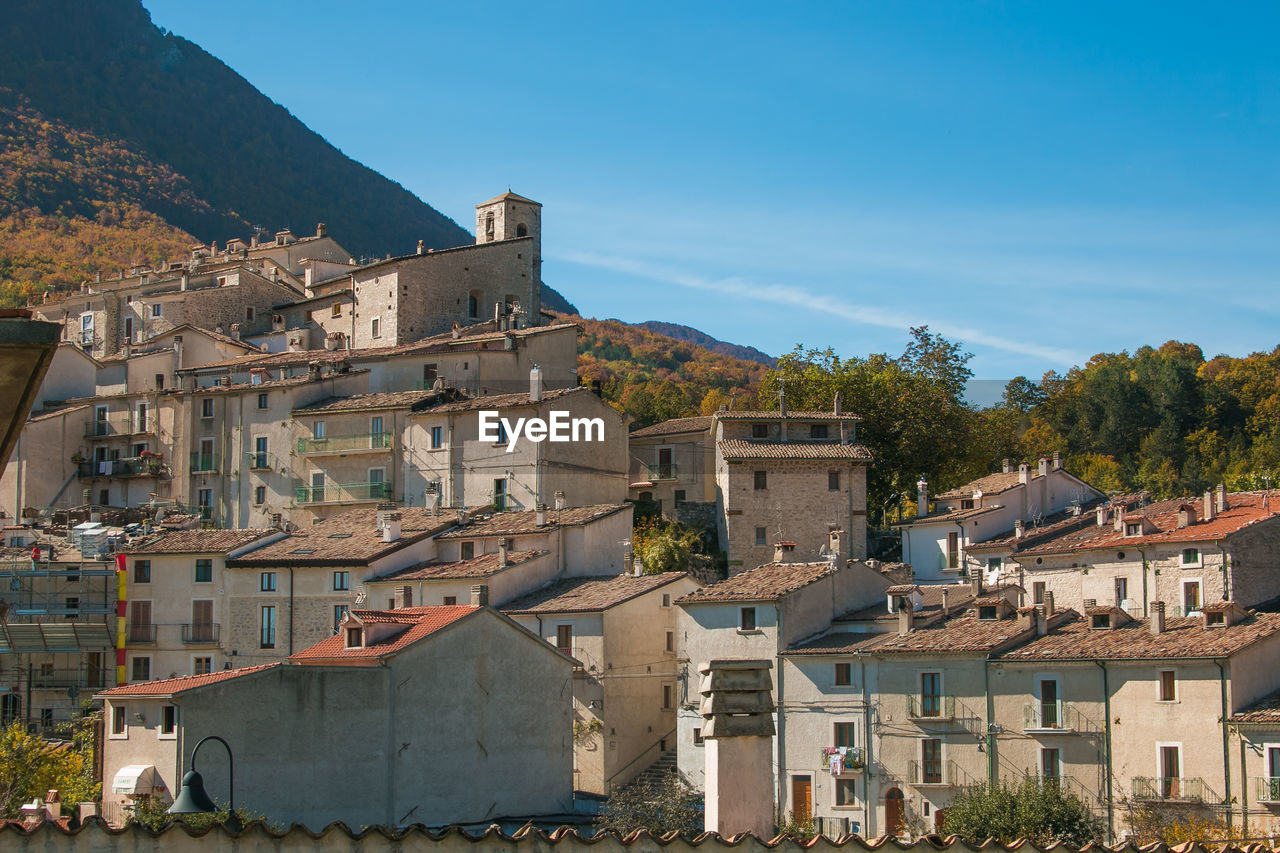 TOWNSCAPE AGAINST BLUE SKY