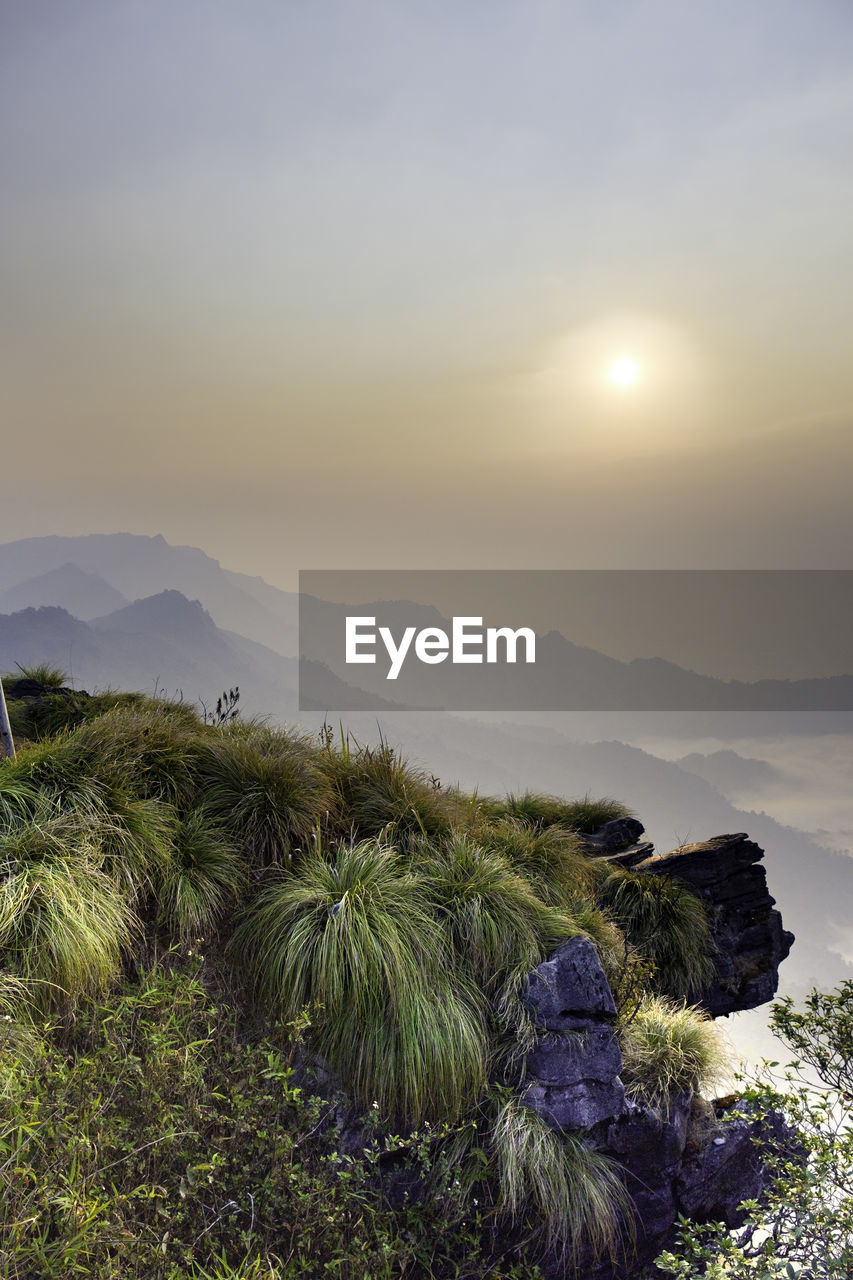 Scenic view of mountains against sky during sunset