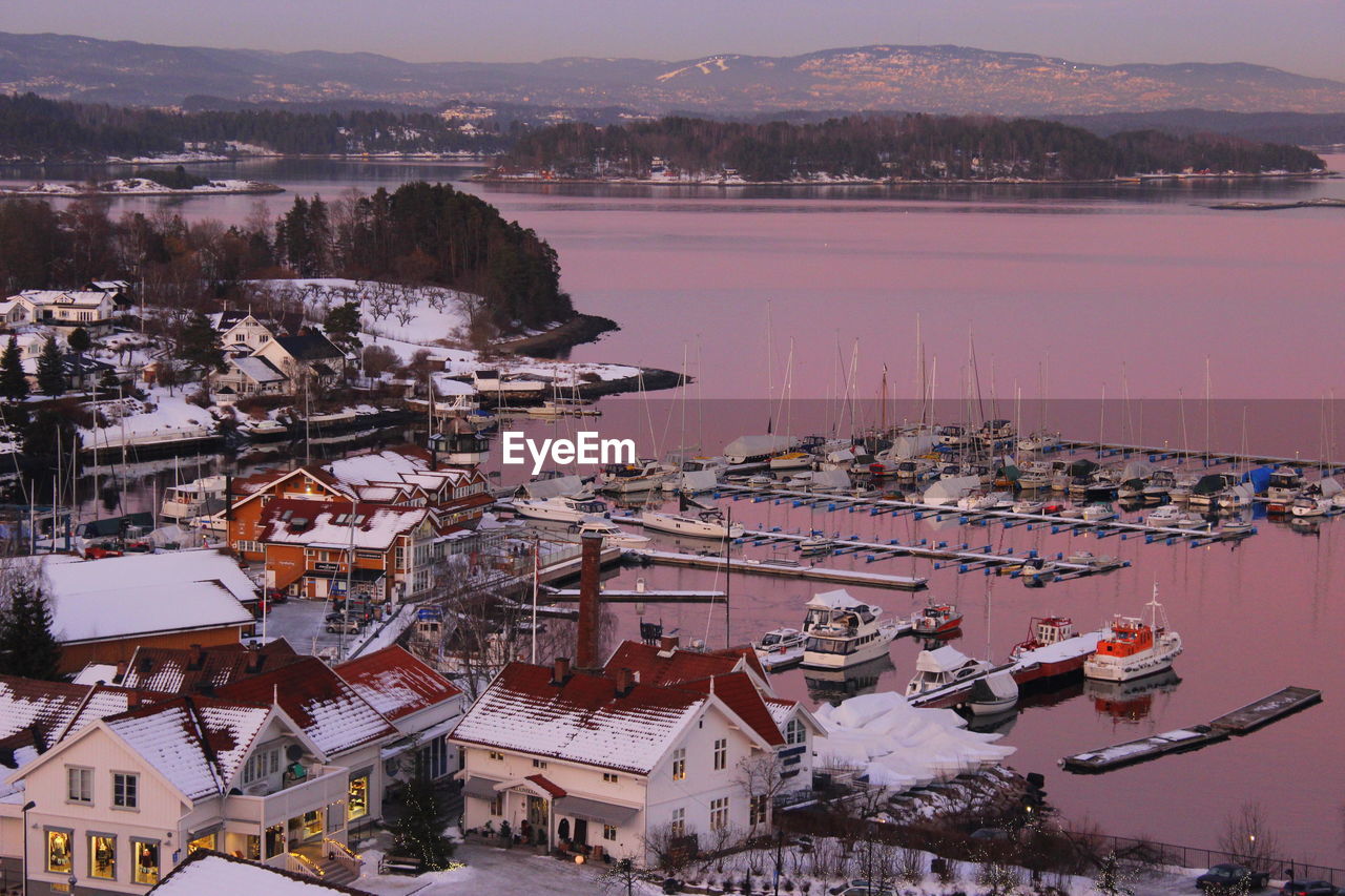 High angle view of houses by lake in town