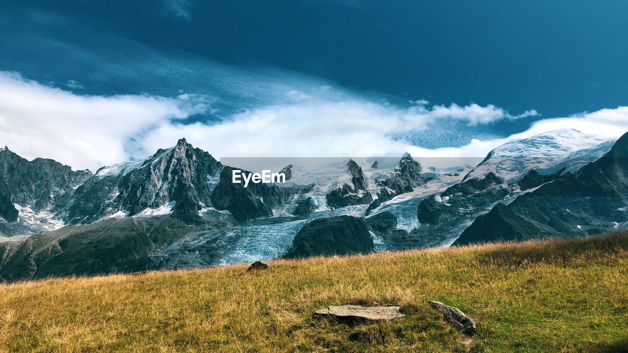 Scenic view of snowcapped mountains against sky