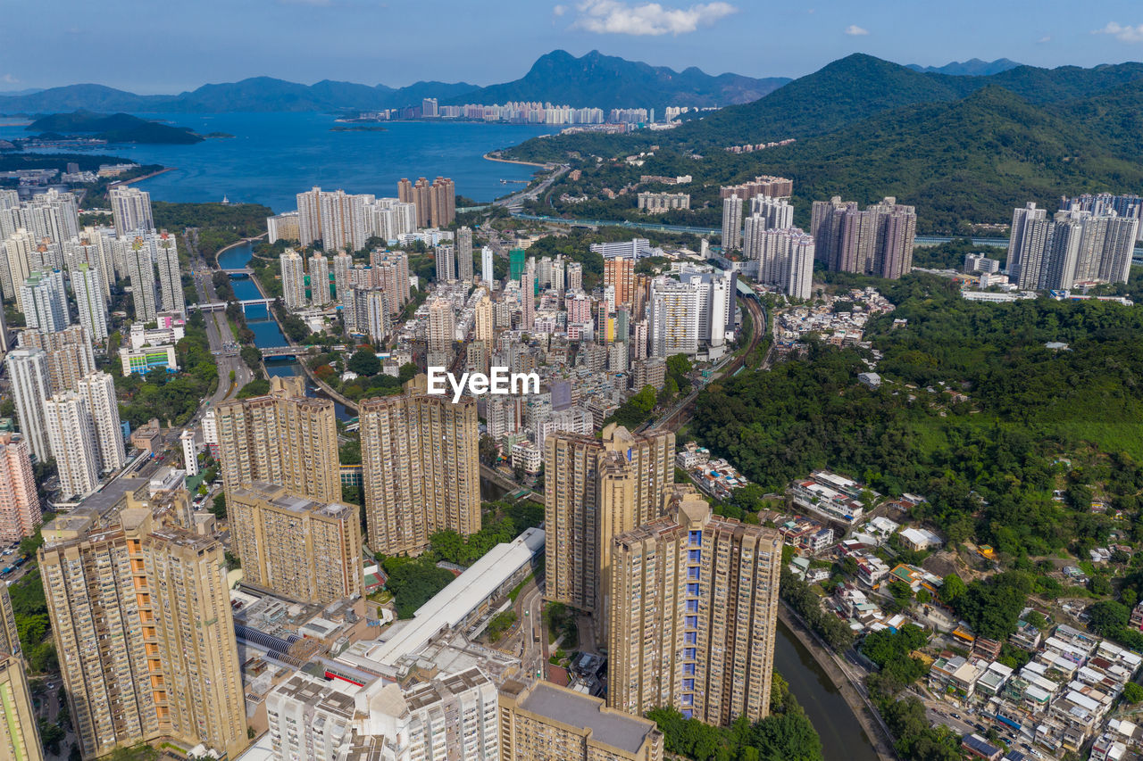 HIGH ANGLE VIEW OF MODERN BUILDINGS IN CITY