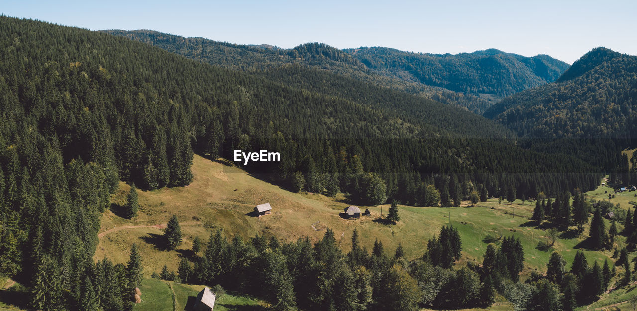 Scenic view of landscape and mountains against sky