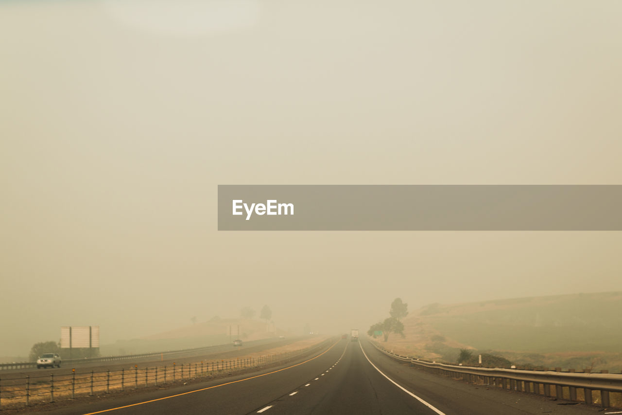 Road against sky during foggy weather