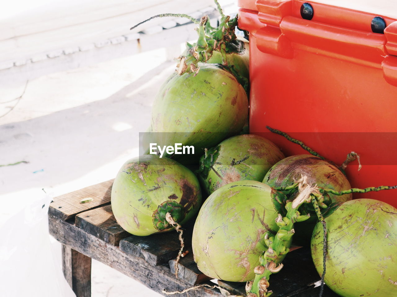 High angle view of fruits on table. coconuts