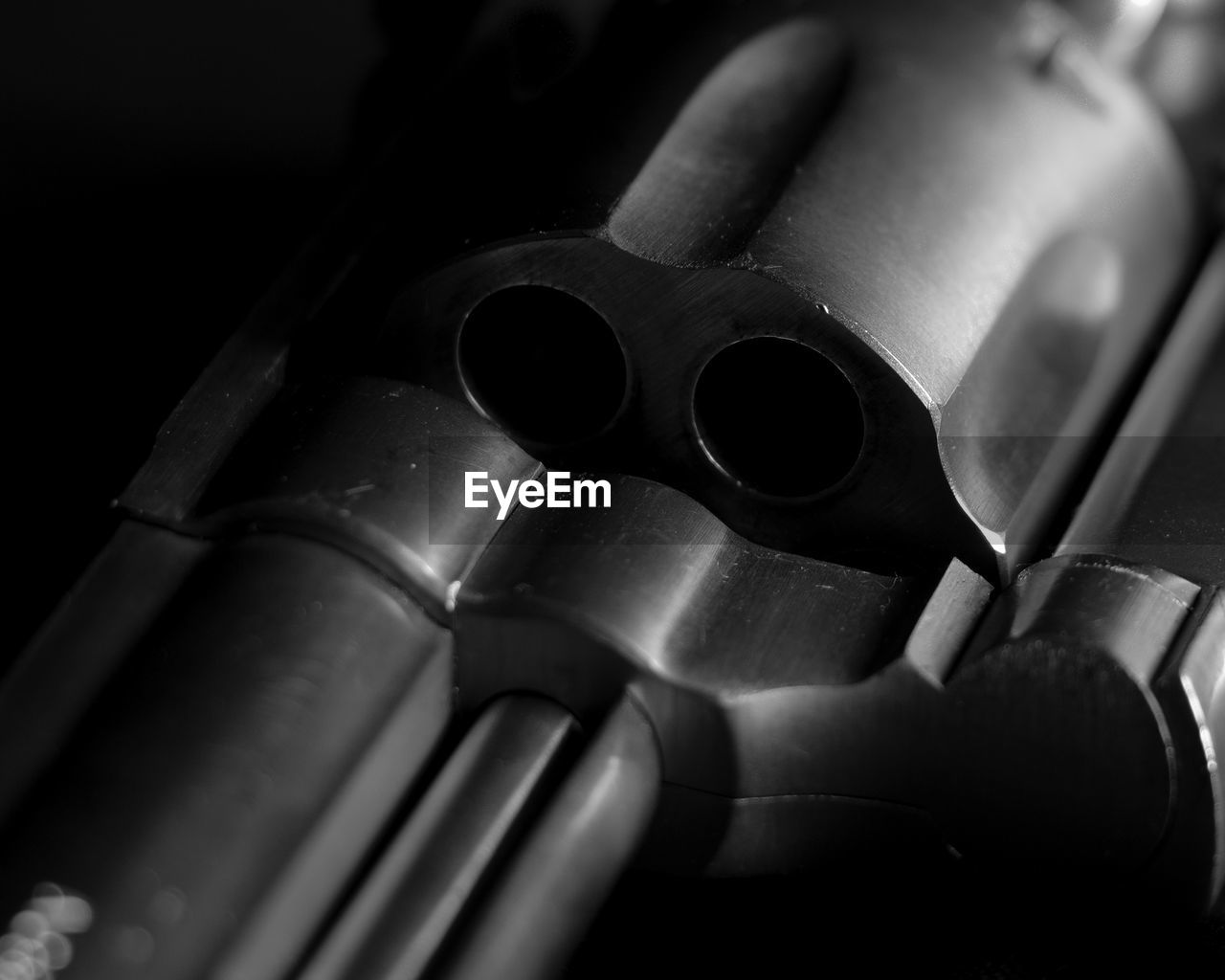 Close-up of gun against black background