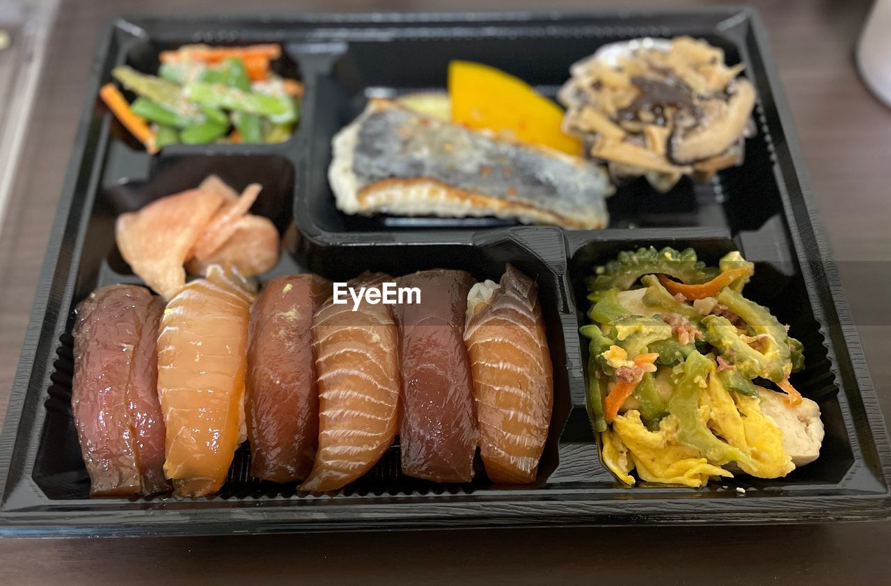 food, food and drink, meal, freshness, seafood, healthy eating, dish, cuisine, asian food, japanese food, no people, wellbeing, indoors, culture, lunch, tray, fish, plate, vegetable, close-up, still life, table, high angle view, fast food, meat, sushi, city, animal