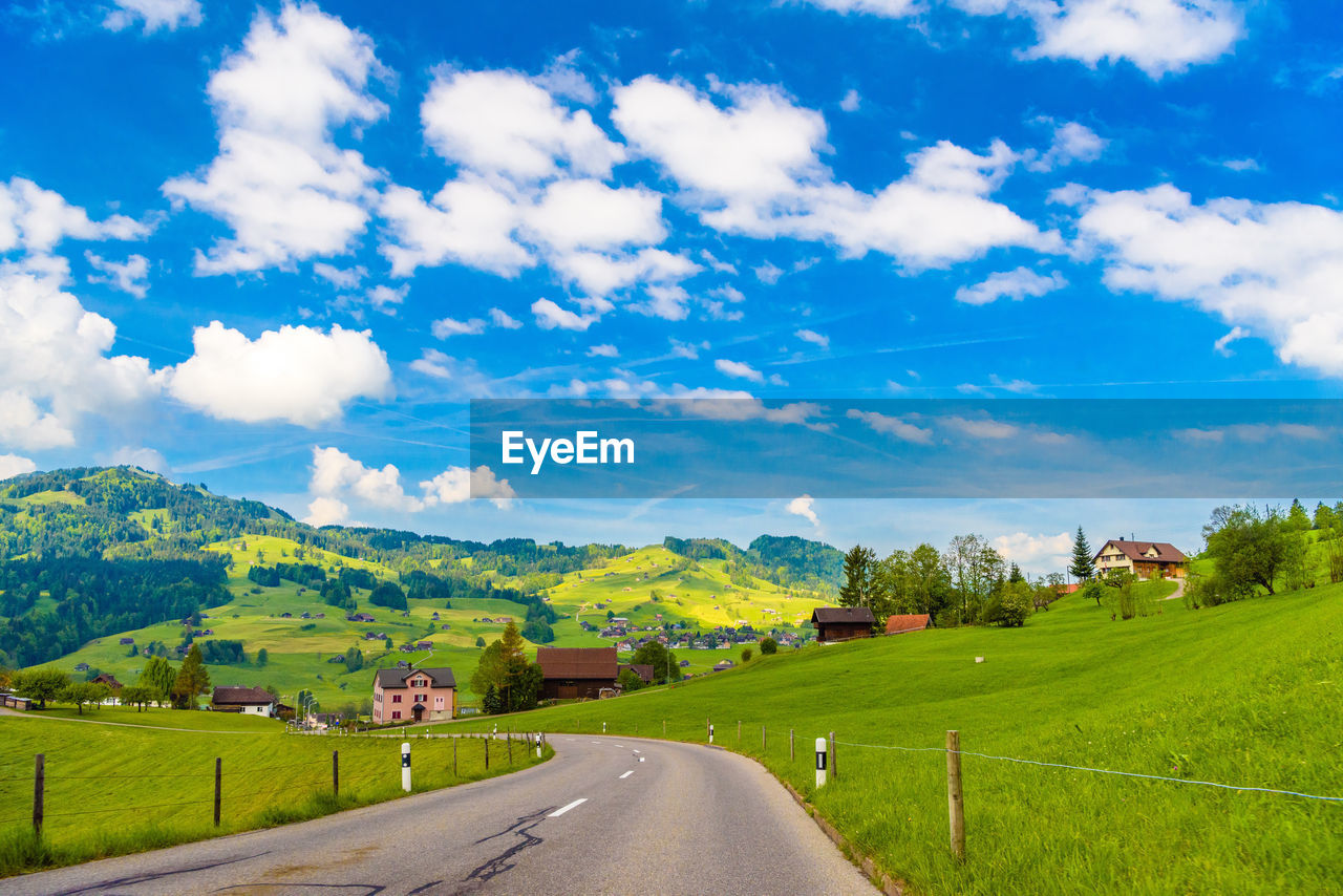 SCENIC VIEW OF ROAD ALONG LANDSCAPE