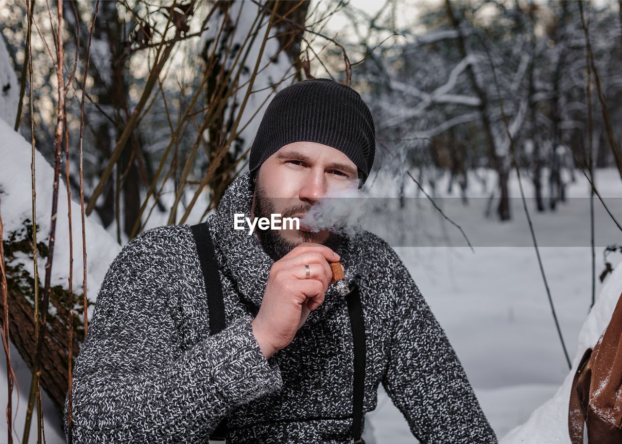 Portrait of young man in snow