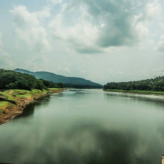 VIEW OF LAKE AGAINST CLOUDY SKY