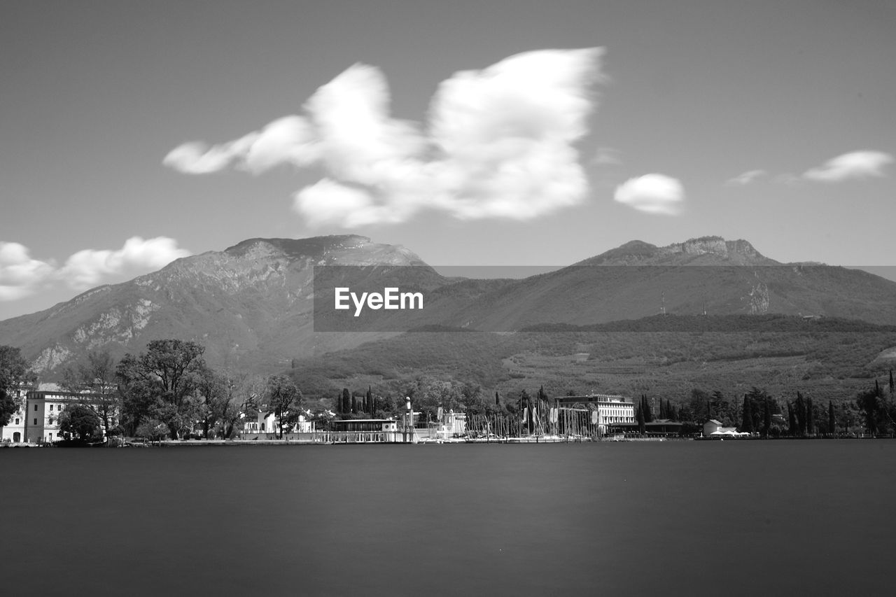 Scenic view of lake and mountains against sky