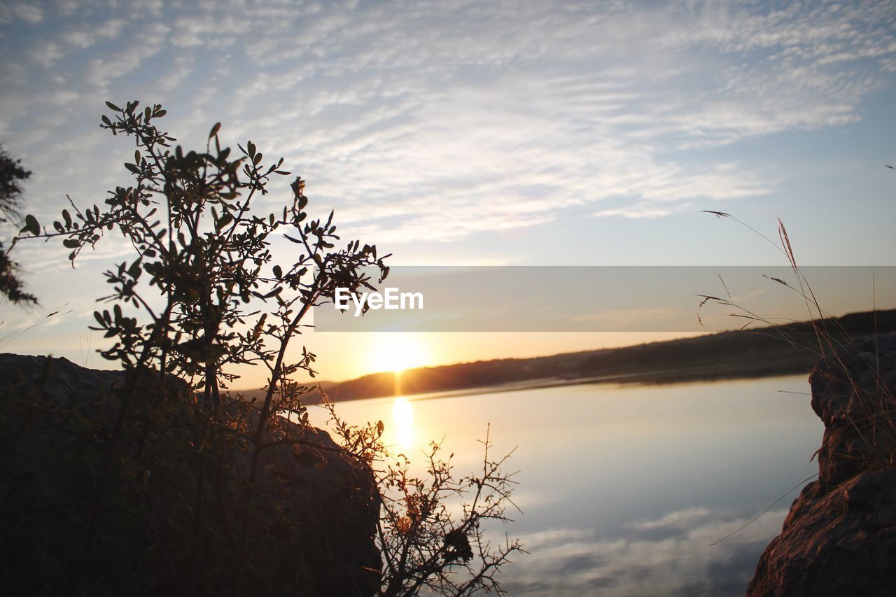 SUNSET OVER LANDSCAPE